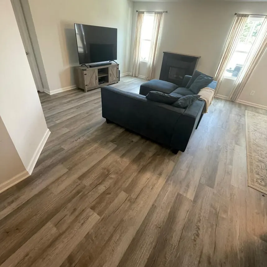 Wood-look porcelain plank flooring across a living room